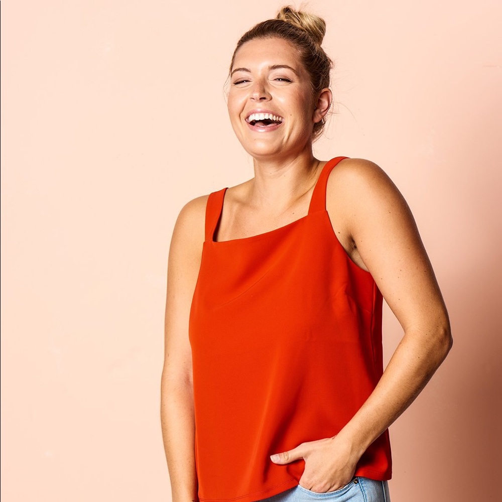 Brass clothing the getaway tank in Tango red